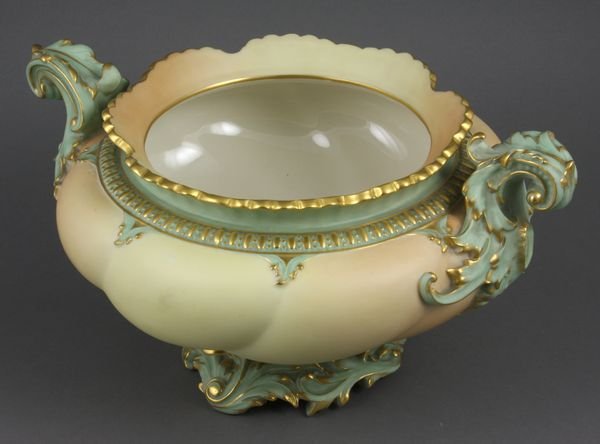 C1895 Royal Worcester Melon Pedestal Bowl: Circa 1895 Royal Worcester melon-form pedestal bowl with figural foliate twin handles and base, 6 1/2"h., 12"dia. handle-to-handle. Good condition.