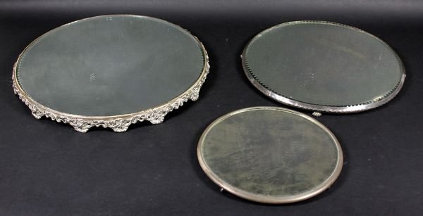 (3) 19th C. Plateaux in Silverplate, Pairpoint, et: Three (3) 19th Century plateaux mounted in silverplate, to include one marked "Pairpoint", 14"dia., minor silver loss; one marked "Higgins, Rodgers Co.", 10"dia.; one unmarked, 16 1/4"dia. All with mi