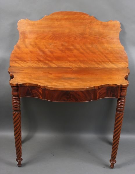 C1820 Boston Birch & Mahogany Game Table: Circa 1820 North Shore Boston game table, 29"h. x 37 1/2"w. x 17 1/2"d., of mixed woods, figured birch and mahogany, with reverse serpentine front and spiral turned legs. Legs are loose at top.