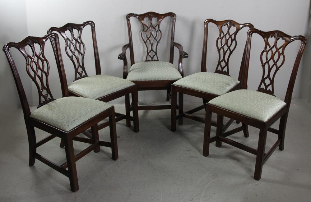 Set of Mahogany Chippendale Style Dining Chairs: Set of seven (7) Chippendale-style mahogany dining chairs with upholstered seats, two armchairs, five side chairs, armchair measures 38" H x 25 1/2" W x 21" D. Provenance: Estate of Norma Szaro, Swamp