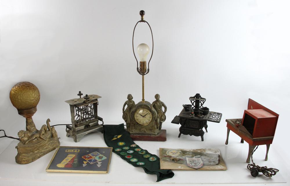 Antique Miniature Stove, Deco Clock, etc.: Antique miniature iron stove, tin stove, toaster, deco clock and lamp, with girl and boy scout items. Provenance: Burlington, Massachusetts estate.
