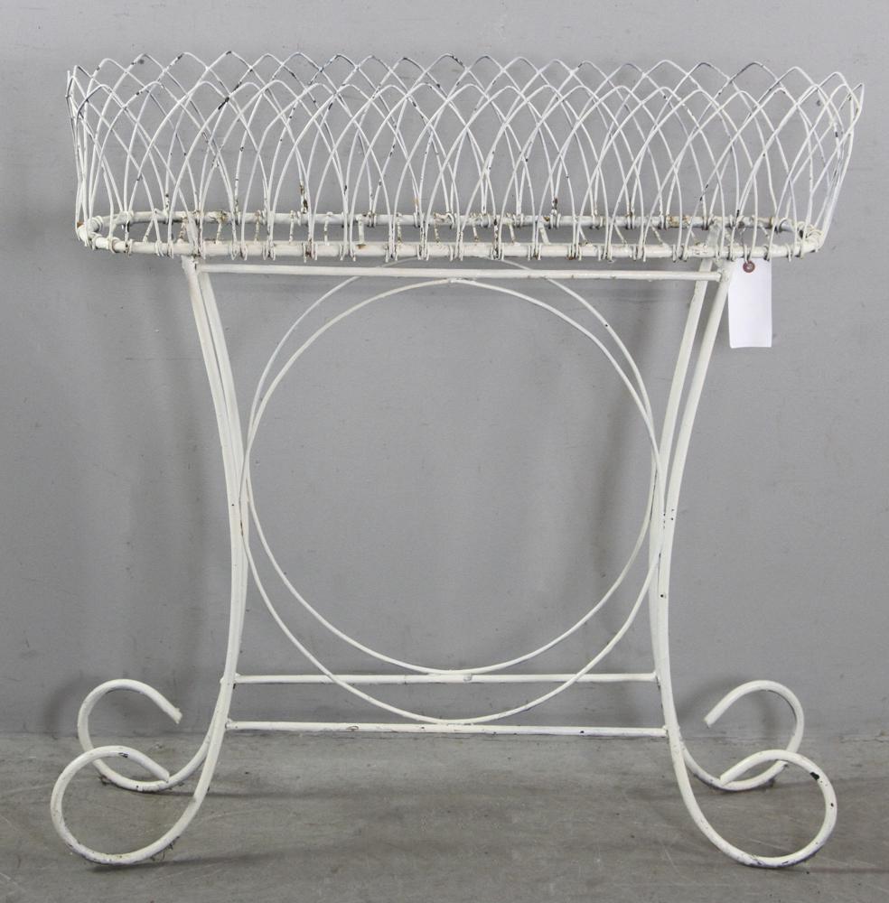 Wrought Iron Plant Stand: White wrought iron plant stand, 37" x 35 1/2" and 10 1/4" base. Provenance: Newburyport, Massachusetts estate.