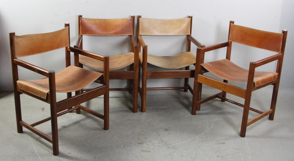Michel Arnoult Safari Chairs, Set of (4): Set of four safari chairs designed by Michel Arnoult, Brazilian hardwood and leather, one with original label. Provenance: Ashland, Massachusetts estate.
