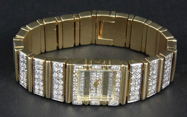 14k Yellow Gold and Diamond Piaget Watch: 14k yellow gold and diamond Piaget watch, 6 3/4"l., face 3/4"dia. 2.2 ozt total weight. Good condition.