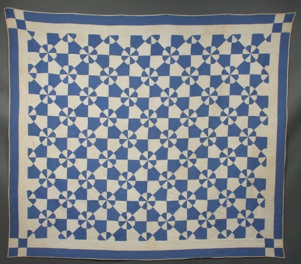 Early 20th C. American Handstitched Quilt: Early 20th Century American blue and white handstitched quilt, 80" x 68". Good condition; minor discoloration.