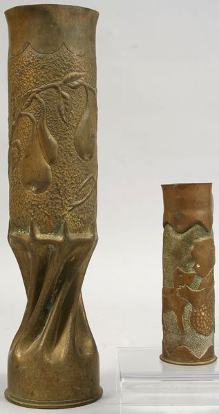 (2) WWI BRASS TRENCH ART SHELL CASINGS: Two WWI brass trench art shell casings, including: one pear tree twisted, bottom marked 'NYAB 75 Dec 5 16', 13"h.; one girl kissing dog, marked 'WMFG Co 1918 Lot 48 DDR J.B.S.', 5 1/2"h. No major dent