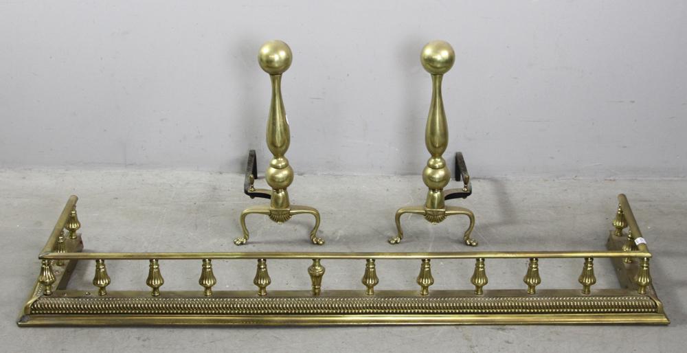Brass Ball Top Andirons and Fender: Brass ball-top andirons and fender, andirons 22" H x 17" L, fender 7" H x 60" W x 15" D. Provenance: Estate of Norma Szaro, Swampscott, MA.
