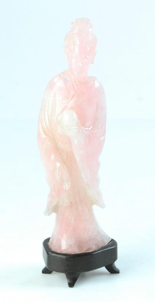 Chinese Carved Quartz Lady Figure: A 19th century pink quartz carved figure depicting a court lady holding a peach with old repairs with wood stand. Height: 17 cm, 6 3/4".