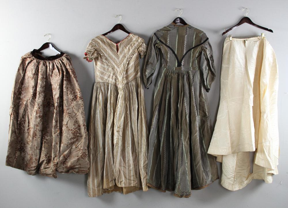 19th/20th Century Women's Clothing: Late 19th/early 20th century women's skirts, dresses, etc. some designed for wear with a bustle, various fabrics, large storage bin full, as found condition. To benefit a local Massachusetts museum.