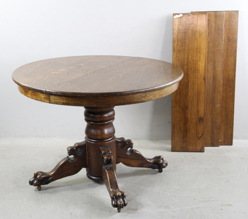 Victorian Oak Table with Lion Claw Feet: Victorian Oak Round Dining center table with lion claw feet, 30" H x 42" D and three 10 1/4" leaves, Provenance: Boston, MA.
