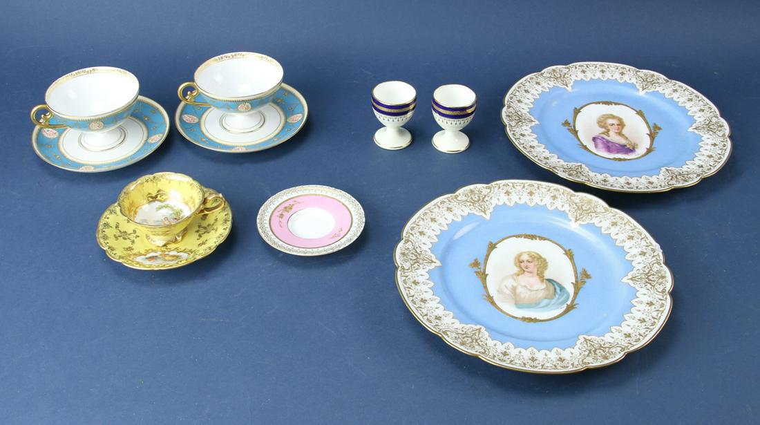 Lot of Eleven Fine Porcelain Pieces: Lot of eleven fine porcelain pieces, (7) cups and saucers, (2) egg cups and (2) plates. Provenance: From the estate of Gregory and Katherine Sullivan of Dover, MA.