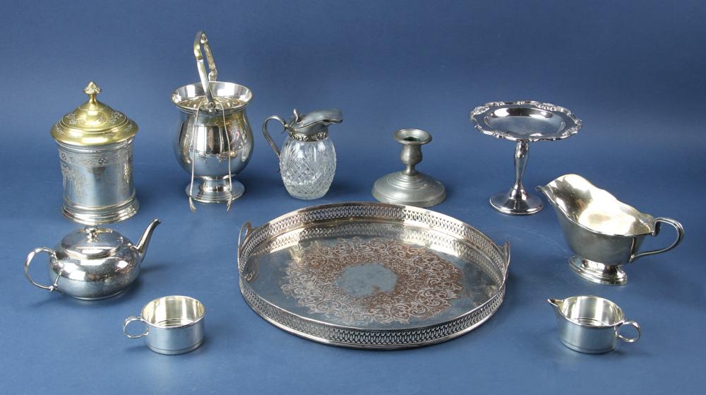 Lot of Twelve Assorted Pieces: Lot of (12) to include: silver plate, Sheffield, teapot, pewter candle sticks, and pitcher. Provenance: From the estate of Gregory and Katherine Sullivan of Dover, MA.