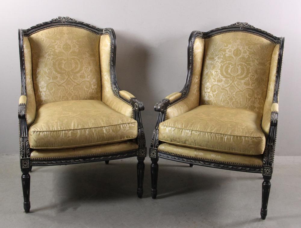 Pair of Black Painted Wing Chairs: Pair of black painted wing chairs with gold silk. Provenance: From the estate of Gregory and Katherine Sullivan of Dover, MA.