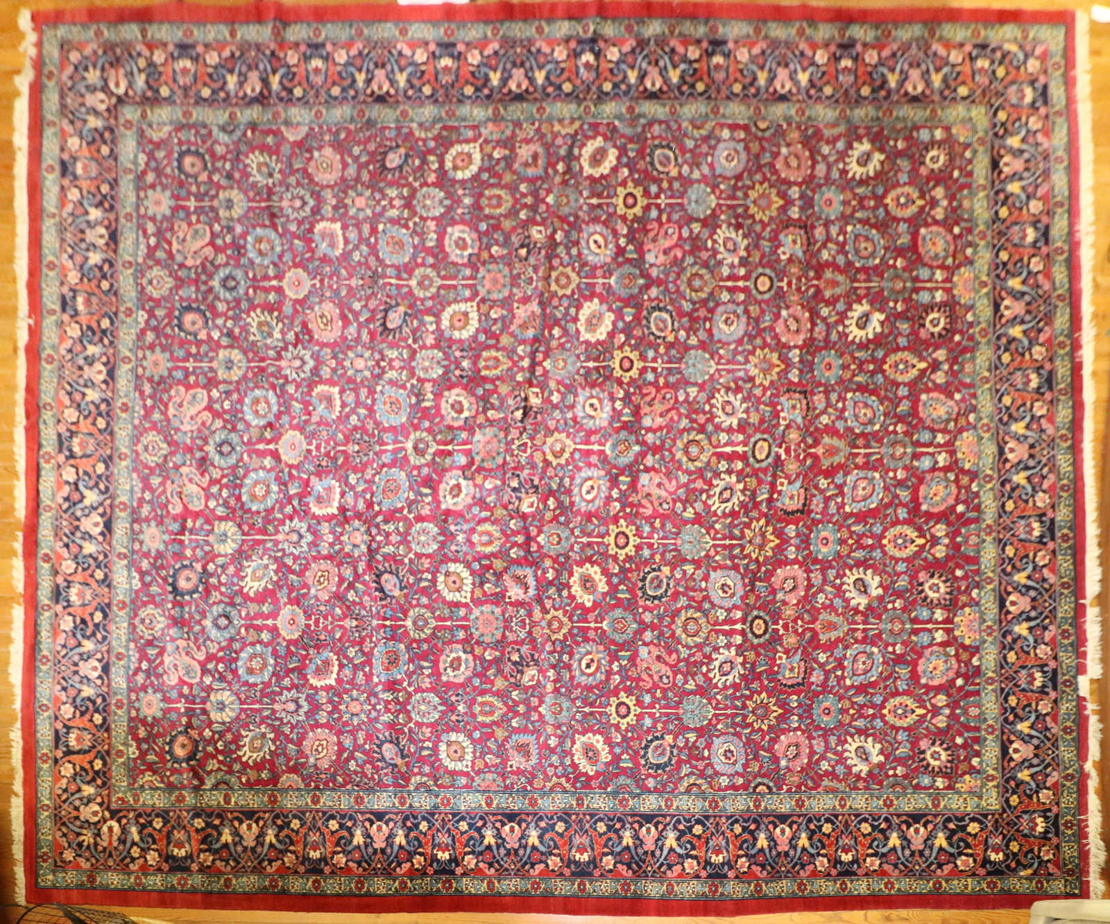 Large Room-Sized Oriental Rug: Large room-sized Oriental rug, wine-colored field. Provenance: From the estate of Gregory and Katherine Sullivan of Dover, MA.