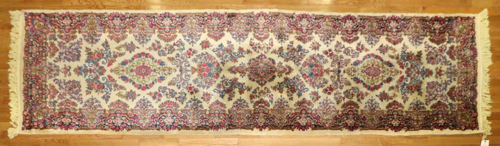 Oriental Runner Red and Blue on Ivory Field: Oriental runner, red and blue on ivory field. 14'4" x 4'. Provenance: From the estate of Gregory and Katherine Sullivan of Dover, MA.