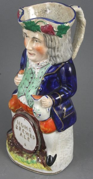 Early 19th C. English Staffordshire Toby Jug: Early 19th Century English Staffordshire Toby jug, 10 1/4"h. Minor chips; crazing; light staining.