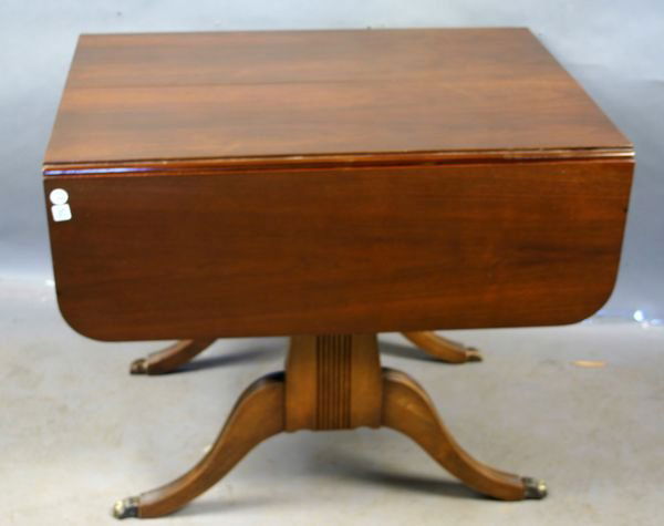 1920s/30s Duncan Phyfe Drop-leaf Dining Table: 1920s/30s Duncan Phyfe mahogany drop-leaf dining table, 30" x 38" x 53"l. Missinge two brass feet.