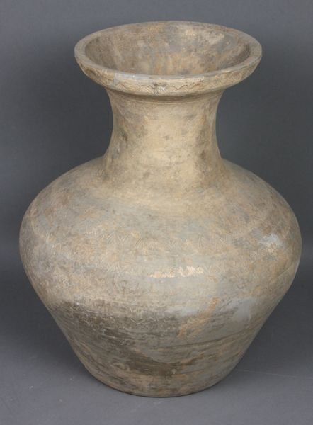 Han Dynasty Incised Earthenware Vessel: Han Dynasty (220 B.C - 250 A.D.) unglazed earthenware vessel with incised design, 11 1/2"h. x 9"dia. Good condition.