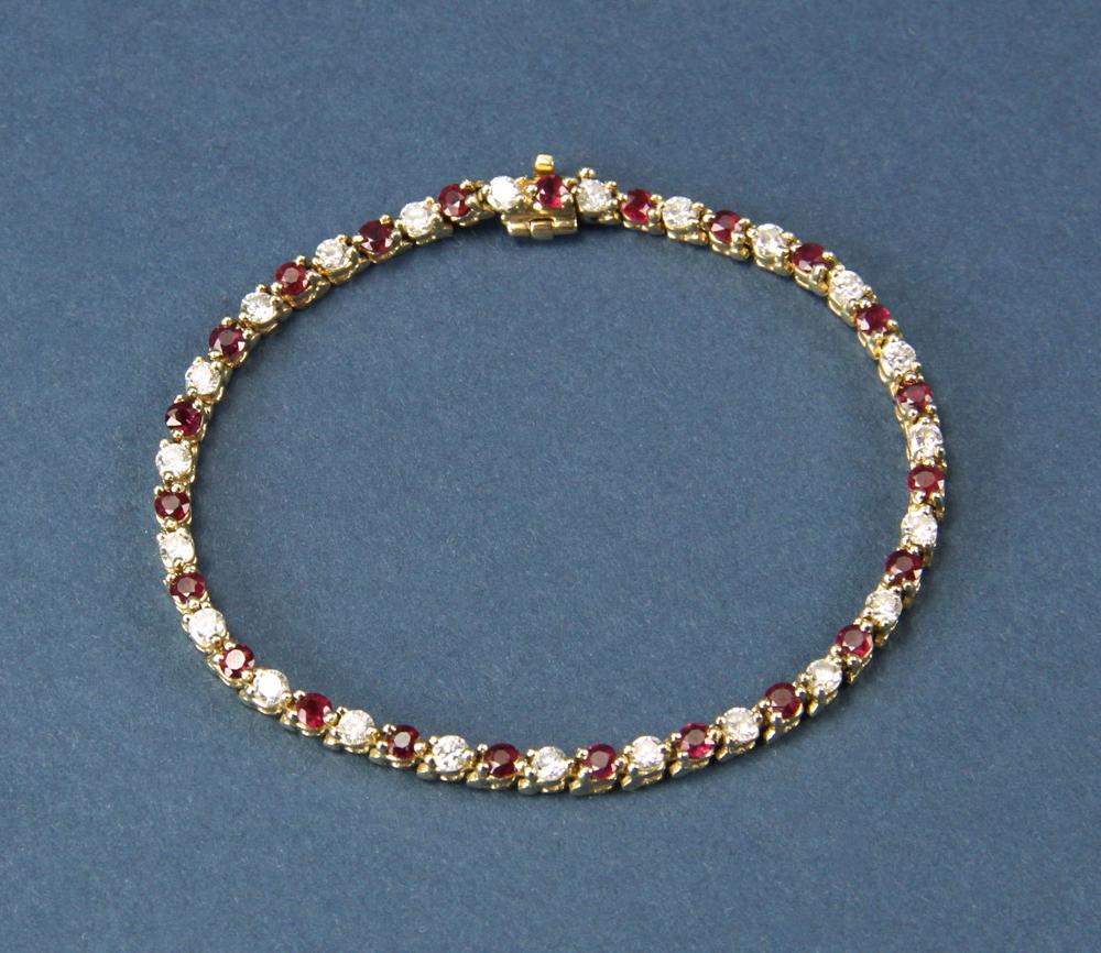 14kt Gold Diamond and Ruby Bracelet: 14kt gold diamond and ruby bracelet 7", 10 grams, 23 diamonds approx. 1/16ct each, 23 rubies approx 3mm each. PLEASE NOTE: payment for silver, gold, jewelry, and coins must be made via PayPal, cash, o