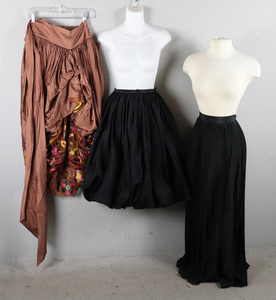 Romeo Gigli, Brioni Skirts: Romeo Gigli copper long skirt with embroidery, size 44, Brioni full-length chiffon skirt, size 10-12, and black short satin skirt, maker unknown, size 10-12.