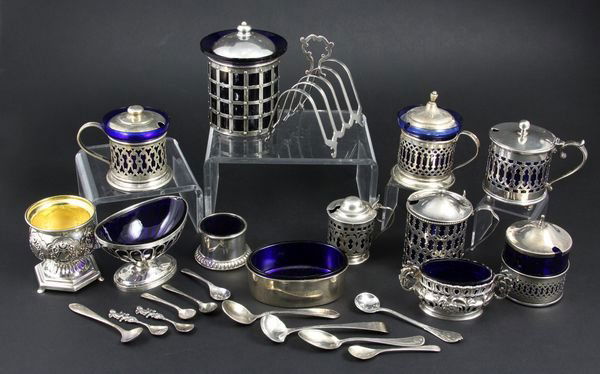 Collection of Early 20th C. Sterling Table Items: Collection of early 20th Century sterling table items to include toast rack, salts and mustards, most with cobalt glass liners, by American silversmiths to include Bigelow, Kennard & Co, Lunt, etc., l