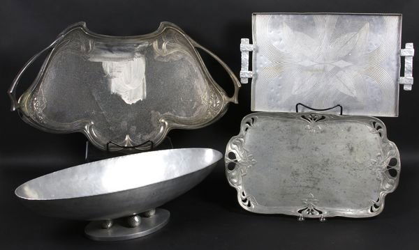 (4) Aluminum and Silverplate Trays and Bowls: Group of four (4) aluminum and silverplate trays and bowls, including an Art Deco center bowl by Palmer Smith, 6"h. x 22 1/2"w. x 8 1/2"d. Some finish wear.