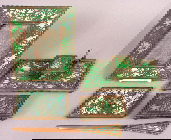 CIRCA 1920 RIVIERE STUDIOS PARTIAL DESK SET: Circa 1920 Riviere Studios, New York, bronze with green slag glass, partial desk set to include letter opener, 10 1/2", good condition; ink well, 9" x 5", missing one pen rest and loose cover; frame,