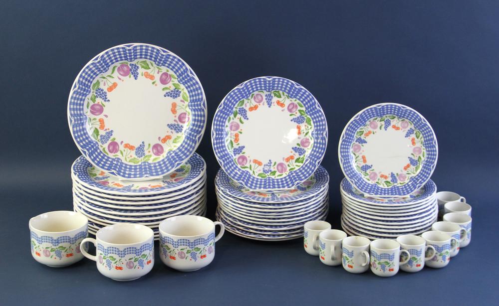 Italian Dinnerware Set: Italian dinnerware set, plums, grapes, and cherries, with blue checkered border, marked Cipa. Provenance: Other estates.