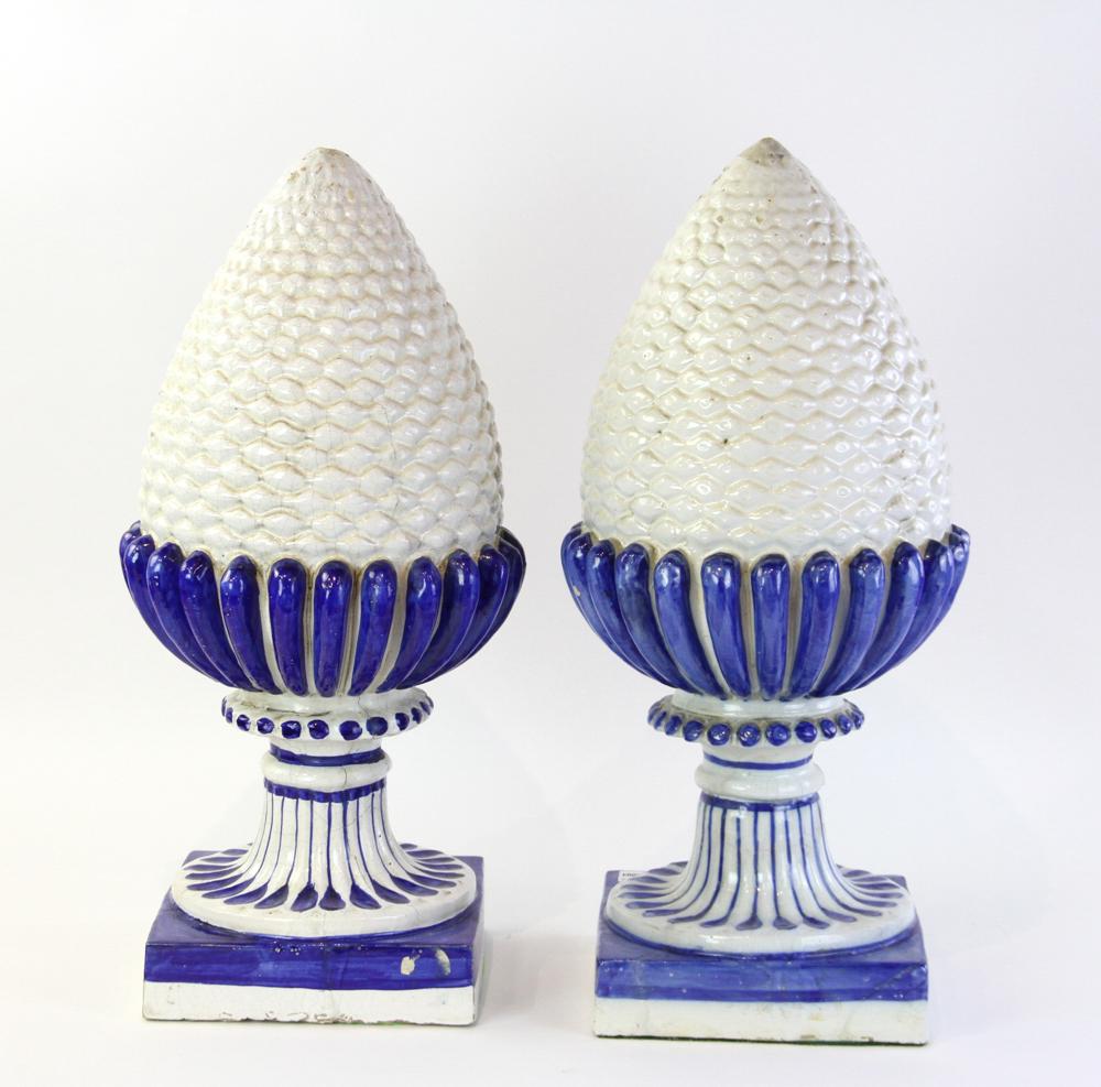 Pineapple Glazed Finials: Pair of glazed pottery pineapple finials, 23" H x 10 1/2". One with old age cracks.