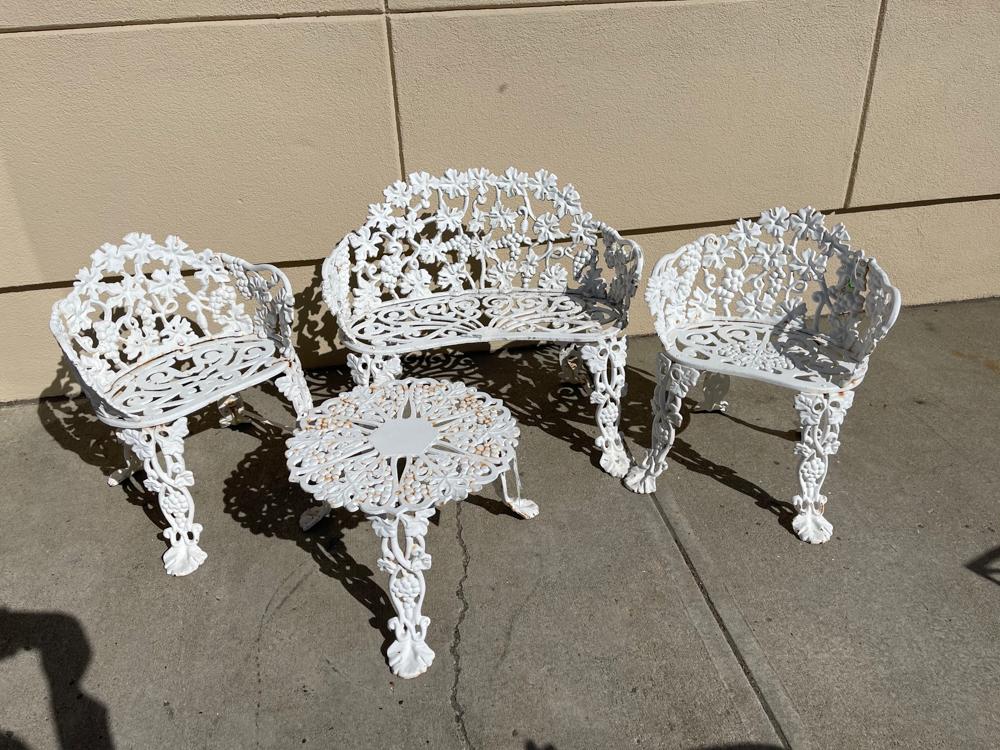 Pair of Metal Patio Settees: Pair of metal patio settees, painted white. Provenance: Other estates.