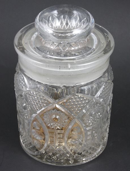 19th C. Victorian Pressed Glass Tobacco Jar: 19th Century Victorian pressed glass tobacco jar, 8 1/2"h. x 5 1/2"dia. Chips to rim of cover.