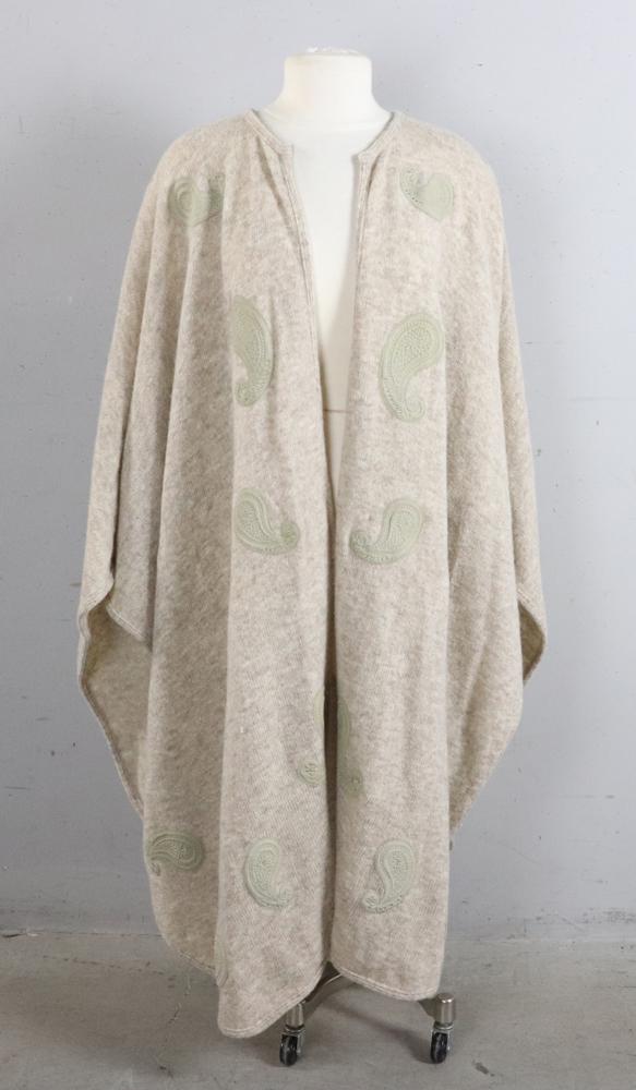 Christian Dior Sweater Cape: Christian Dior beige heather sweater cape with suede decoration.