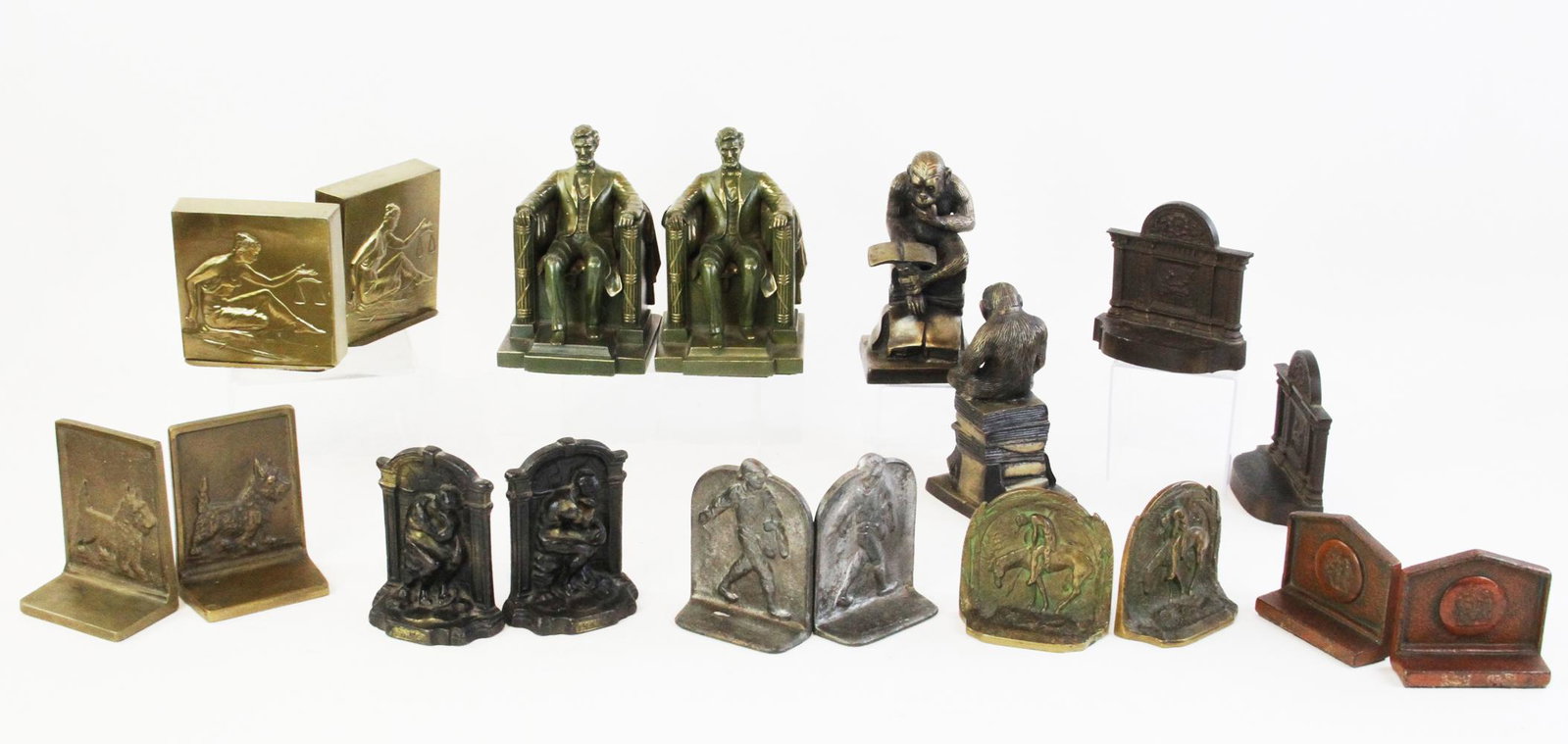 Collection of Ten Pairs of Bookends: Collection of (10) pairs of bookends, including Abraham Lincoln, The Thinker, The Monkey Thinker, The Sower, The End of the Trail, Scottie Dog, Classic Scholar, Pompeii Scene, Lady Justice. Provenance