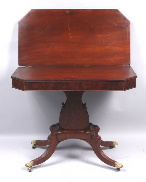 Early 19th C. Duncan Phyfe mahogany card table: Early 19th Century Duncan Phyfe mahogany card table, 28" h. x 36" w. x 18" d. (closed). Finish wear to top.