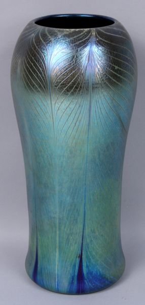 Tiffany blue Favrile peacock feather vase: Tiffany blue Favrile peacock feather vase, signed, numbered, and labeled on base, 12" h. Good condition.