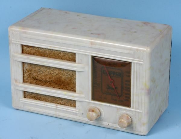 Clipper beetle plastic push button radio: Clipper beetle plastic push button radio, 10" x 5", c. 1935.