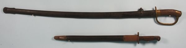 one 19th C. sword and one bayonnet: Two (2) weapons to include one (1) 19th Century sword having wood grip and brass guard, 31 3/8" l. (blade), 39" l. (overall), 8" sheath; one (1) bayonnet blade marked 'Wilkerson 1907'. Some corrosion.