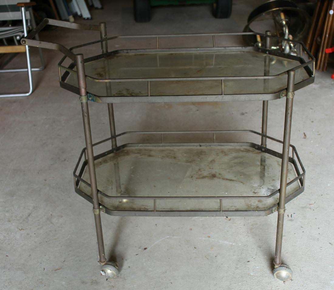 Solid Brass and Glass Drinks Cart: Solid brass and glass drinks cart on brass castors, 30 1/2" H (excluding handle) x 30" L x 18 3/4" W. Good condition, needs cleaning and polishing. Provenance: Collection of Pat and Nathan Kornfeld, V