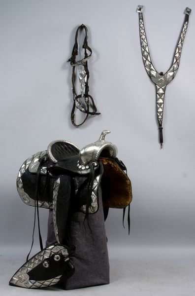 Exceptional 1930s/1940s Western Saddle: Exceptional 1930s/1940s hand tooled western saddle, attributed to Edward Bohlin, elaborate hand chased silver decoration and mounts, similar to saddles used by Gene Autry, Roy Rogers and Tom Mix.