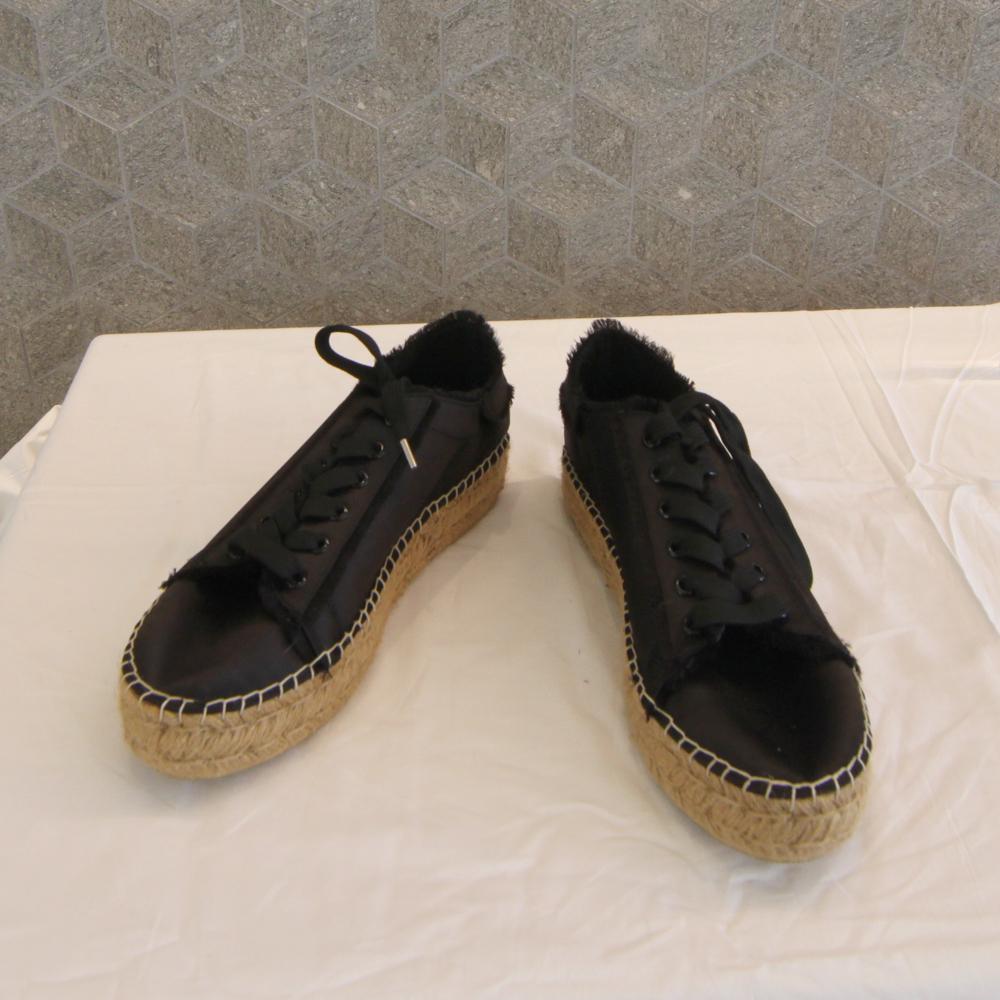 Steve Madden Black Sneakers: Steve Madden black sneakers with woven soles. Size 9. Like new condition. Provenance: Estate of Hilary Musser, West Palm Beach, Florida. PLEASE NOTE: PICK-UP IN WEST PALM BEACH, FLORIDA, OR DELIVERY A