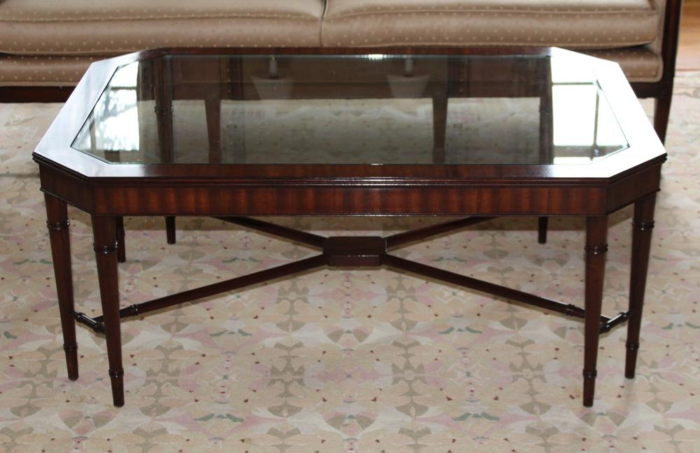 Mahogany Coffee Table with Glass Top: Mahogany glass-top coffee table, 19" H x 46" W x 32" D. Good condition. Provenance: The Waldingfield collection of Arthur Finkelstein and Don Curiale, Ipswich, Massachusetts.