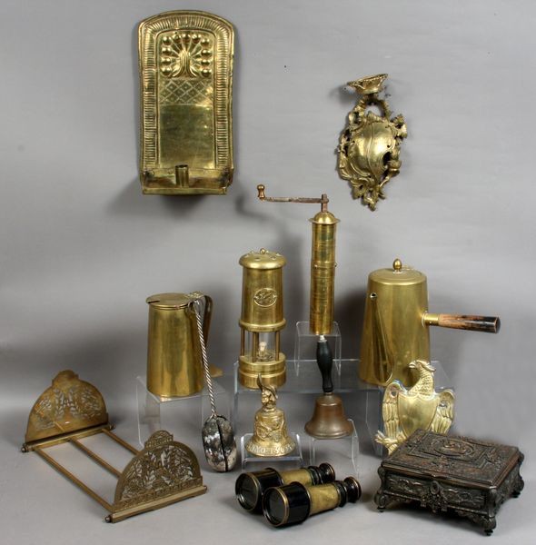 Large Group of 19th and 20th C. Brass Items: Large group of 19th and 20th Century brass items, including 22"dia. handled bowl, fire starter, binoculars, book rack, two ladles, nutmeg churn, two bells, oil lamp, teapot, two flower pots, two wall 