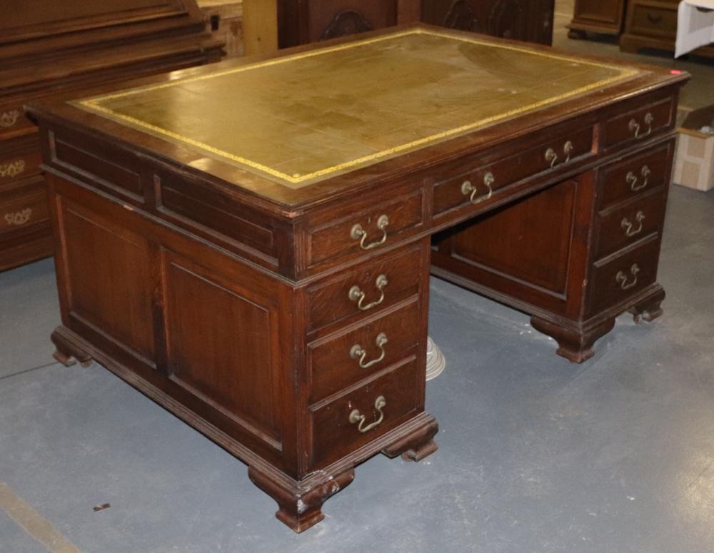 Circa 1880 English Oak Partner's Desk: Circa 1880 English oak partner's desk with tooled and gilt leather top, brass hardware, on castors, 31 1/2" H x 60" W x 41 1/2" D. Good condition. Provenance: Anthony's Pier 4 restaurant, Boston, Mass
