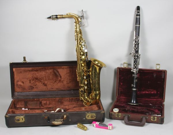 Lot of Two (2) Musical Instruments: Lot of two (2) musical instruments to include: a 1970s wood La Marque clarinet and a 1960s H.N. White king saxophone, both with cases.
