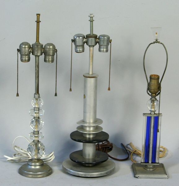 Lot of Three (3) Table Lamps: Lot of three (3) table lamps of chrome and other materials, some Art Deco style, tallest is 21 1/2"h. Some wear and surface dirt. Provenance: From the 20th Century Props lighting collection in Hollywo