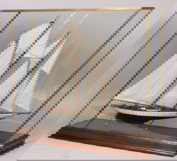 Model of Kaiser Cup Yacht "Meteor IV": Cased model of Kaiser Wilhelm's yacht "Meteor IV," model is expertly rigged with a suit of linen sails and fitted with details including lifeboats, cabins, hatches, rope coils, brass binnacle, wheel,