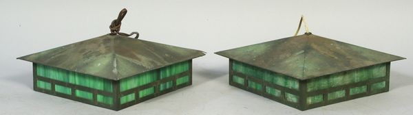Pair of Arts and Crafts Style Pendant Lamps: Pair of Arts and Crafts style pendant lamps of cut brass and frosted glass, 4"h x 12"w x 12"d. Wear and surface dirt. Provenance: From the 20th Century Props lighting collection in Hollywood, C.A.