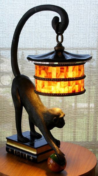 Pair of Maitland Smith Monkey and Book Lamps: Pair of Maitland Smith monkey and book lamps with mother of pearl thin shades, 24 1/2"h x 10"w x 14"d. Good condition.