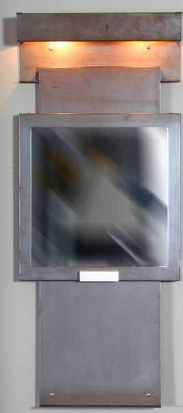 Pierre Chareau, Art Deco Wall Mirror: Pierre Chareau (French, 1883-1950), Art Deco bronzed metal wall mirror with light, 31"h x 13"w. Good condition.