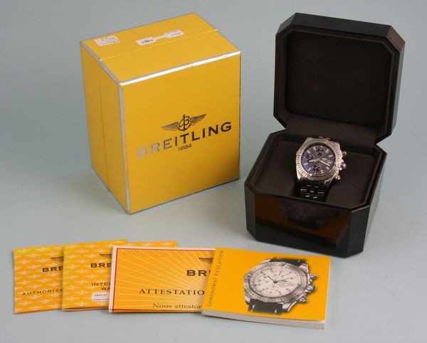 Breitling Automatic Chronograph Men's Watch: Breitling automatic chronograph men's watch, grey and black face, stainless steel 8" bracelet, with box and papers.